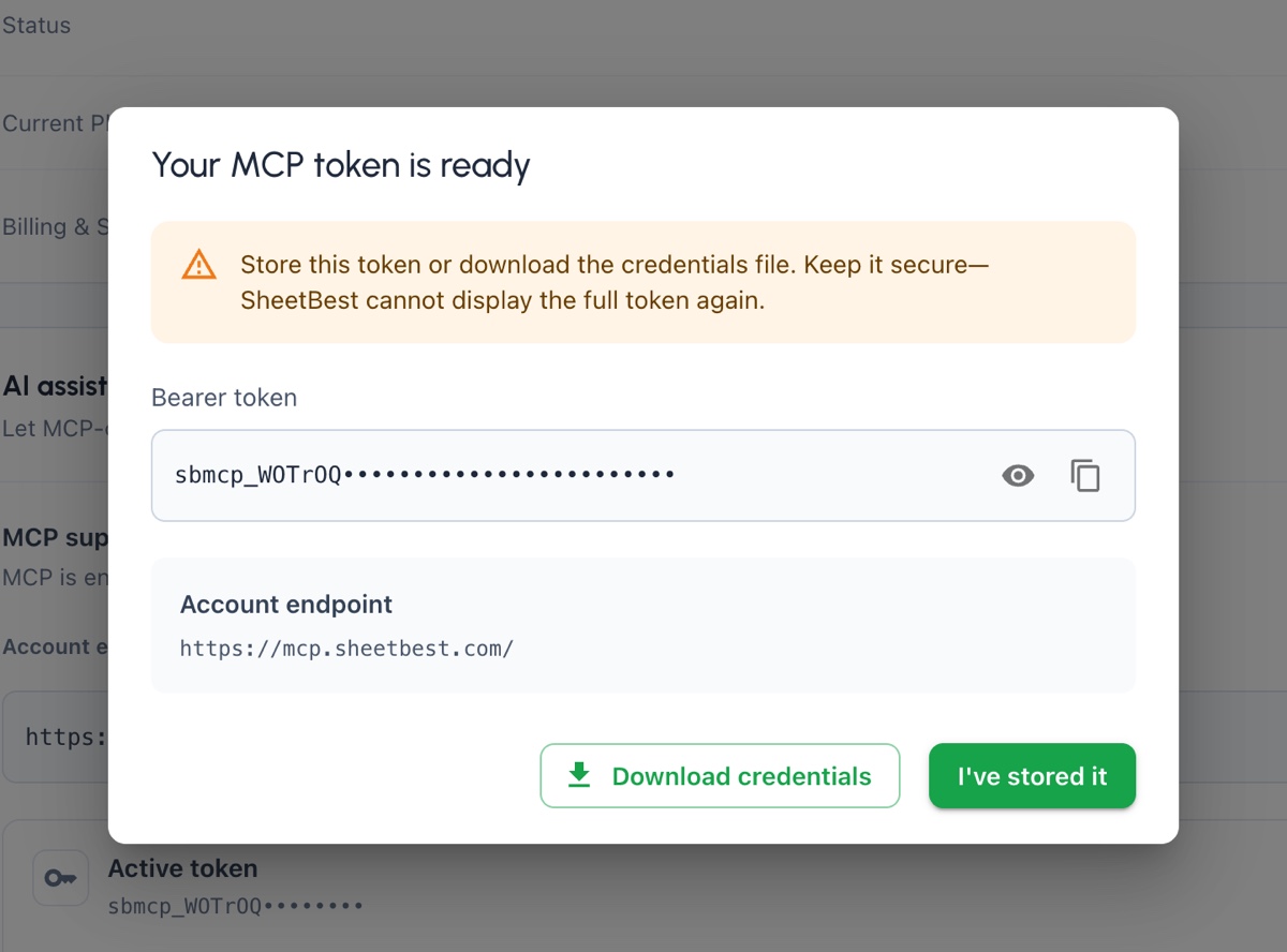 Diálogo de token MCP de un solo uso, con el token oculto y la opción de descargar credenciales.